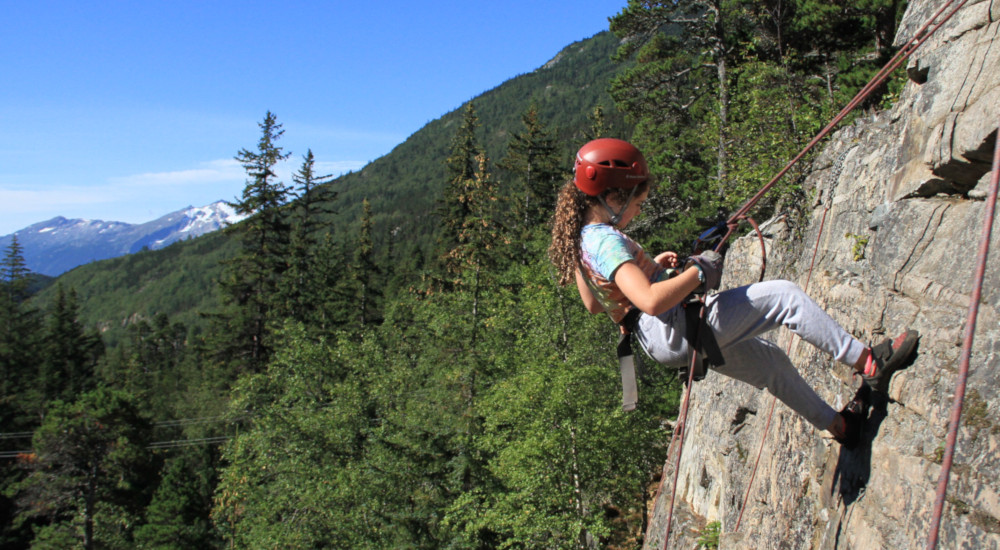 Rock climbing and rapelling on the granite walls of the White Pass